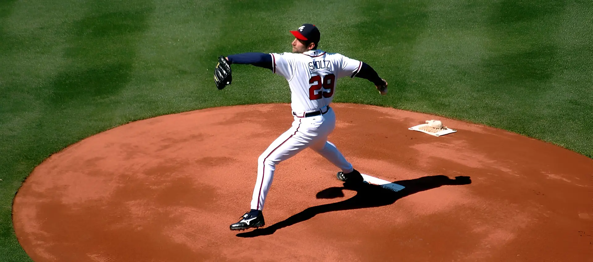 A baseball player is throwing the ball on the field.